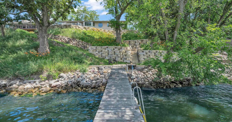 Lakefront property on West Lake Okoboji with a private dock in summer