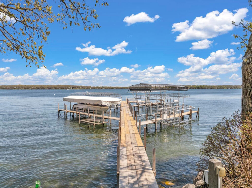 Permitted private dock and boat hoist on a natural lake in Okoboji