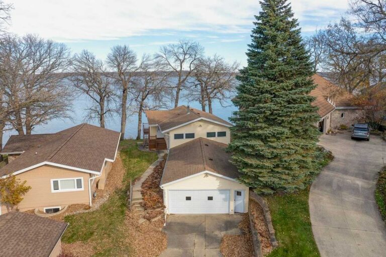 Selling a lake home in Okoboji, lakefront property with dock in early fall on West Lake Okoboji